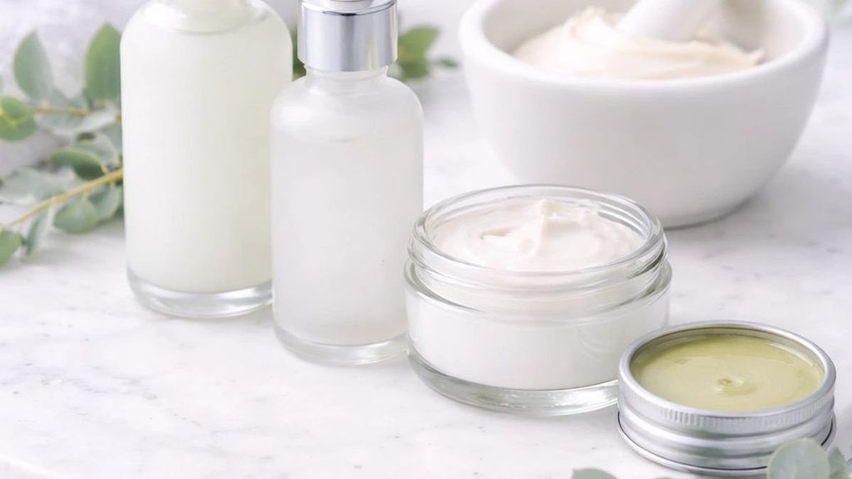 Compounded creams, serums and ointments on a marble tray